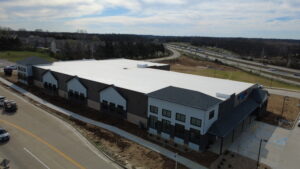 Aerial view of BestBox Storage in Lake St. Louis, Missouri—a multilevel self-storage facility with a basement, featuring a modern, suburban-style design that blends into the surrounding landscape.