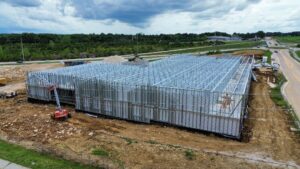 Aerial view of BestBox Storage in Lake St. Louis, Missouri—a multilevel self-storage facility with a basement, featuring a modern, suburban-style design that blends into the surrounding landscape.