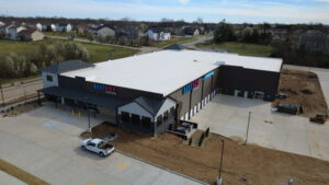 Aerial view of BestBox Storage in Lake St. Louis, Missouri—a multilevel self-storage facility with a basement, featuring a modern, suburban-style design that blends into the surrounding landscape.