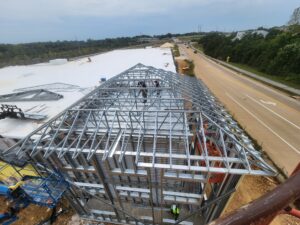 Aerial view of BestBox Storage in Lake St. Louis, Missouri—a multilevel self-storage facility with a basement, featuring a modern, suburban-style design that blends into the surrounding landscape.