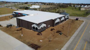 Aerial view of BestBox Storage in Lake St. Louis, Missouri—a multilevel self-storage facility with a basement, featuring a modern, suburban-style design that blends into the surrounding landscape.