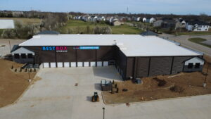 Aerial view of BestBox Storage in Lake St. Louis, Missouri—a multilevel self-storage facility with a basement, featuring a modern, suburban-style design that blends into the surrounding landscape.