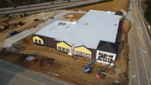 Aerial view of BestBox Storage in Lake St. Louis, Missouri—a multilevel self-storage facility with a basement, featuring a modern, suburban-style design that blends into the surrounding landscape.