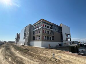 U-Haul Moving & Storage facility in Loveland, Colorado, featuring a 3-story climate-controlled building and three single-story non-climate units with drive-up access.