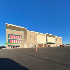 U-Haul Moving & Storage facility in Loveland, Colorado, featuring a 3-story climate-controlled building and three single-story non-climate units with drive-up access.