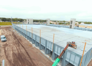 BestBox Storage – Venice, FL | 3-Story Climate-Controlled Self-Storage Facility Three-story BestBox Storage facility in Venice, Florida featuring 94,071 sq. ft. of climate-controlled self-storage units with a drive-through loading corridor.